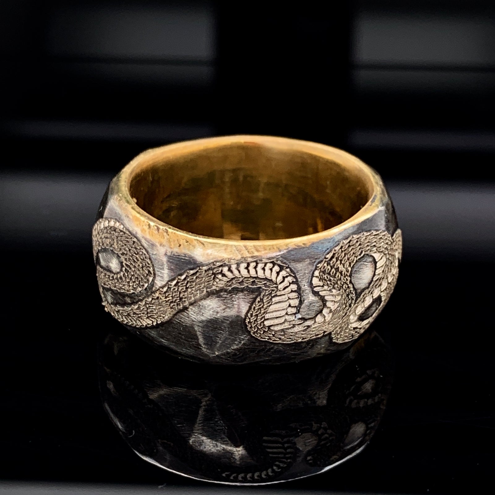 Silver Handcrafted Wedding Band with Custom Engraved Serpent and Green Emerald